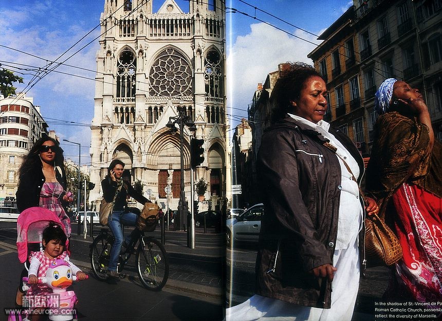 In the shadow of St-Vincent de Paul Roman Catholic Church,passersby reflect the .jpg