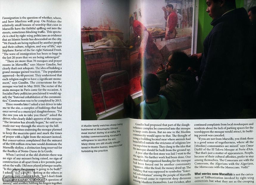 A Muslim family watchs sheep being butchered at Moustapha Slimani meat market du.jpg