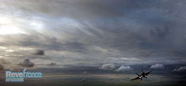 F-18_Hornet_flies_into_a_clouded_sk.jpg